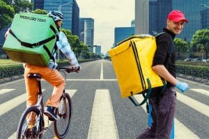 Uber Eats walker and delivery bike in city.