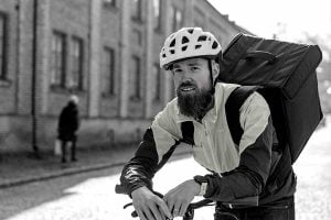 man on bike with food delivery bag