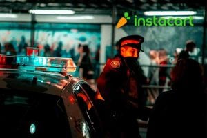 police man outside his car at night