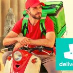 man on moped doing food delivery