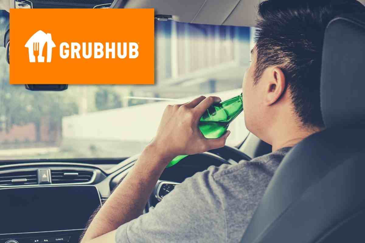 man driving drinking from a bottle.