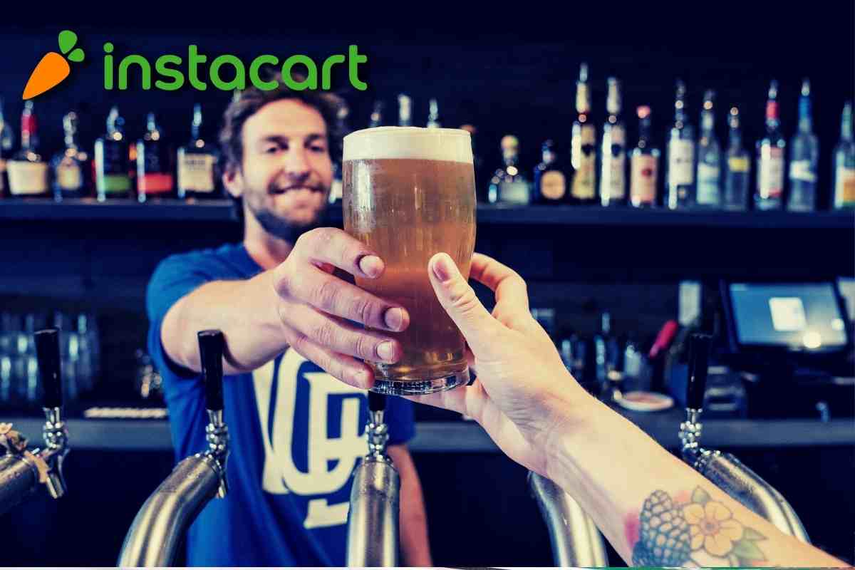 bartender handing beer to customer