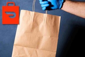 man holding food delivery bag