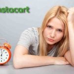 Women waiting by an alarm clock